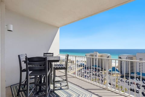 Private balcony with panoramic Gulf and beach views, perfect for sunrise coffee or sunset drinks.