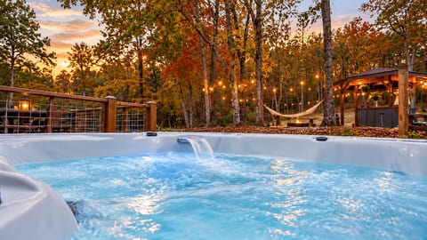 Casita private hot tub on a peaceful ridge, string lights, hammock, and gazebo