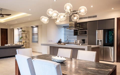 Modern dining area with warm boutique-hotel styling — an inviting space to gather, unwind, and enjoy Puerto Vallarta’s incredible local flavors at home.