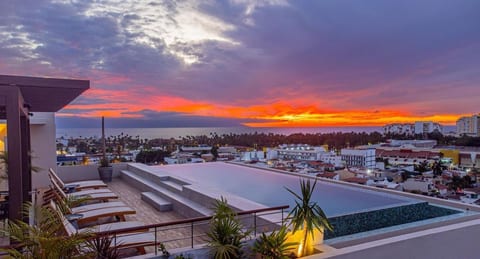 Take in unforgettable sunsets from the heated rooftop pool with sweeping ocean views, lounge seating, and a relaxed resort-style atmosphere above Puerto Vallarta.