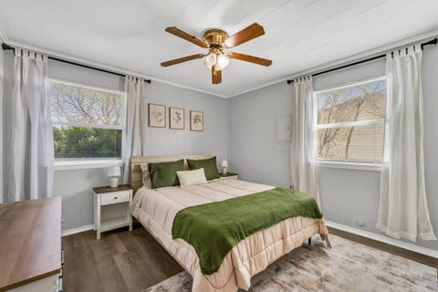 Bright and comfortable queen bedroom offering a peaceful retreat, with soft bedding and extra linens and blankets provided for added warmth and convenience.