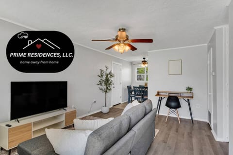 Stylish living room featuring a 55-inch smart TV with free access to Hulu and Disney+. Perfect for relaxing and enjoying your favorite shows and movies in comfort.