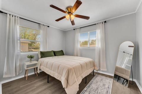 Relax in a stylish queen bedroom complete with fresh linens, extra blankets, and everything you need for a comfortable and restful stay.