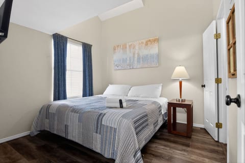 Master suite with a plush king bed, extra linens, blankets, and pillows. Enjoy the Roku TV, a spacious walk-in closet, and direct access to the master bathroom for comfort and convenience. Perfect for a relaxing, private retreat.