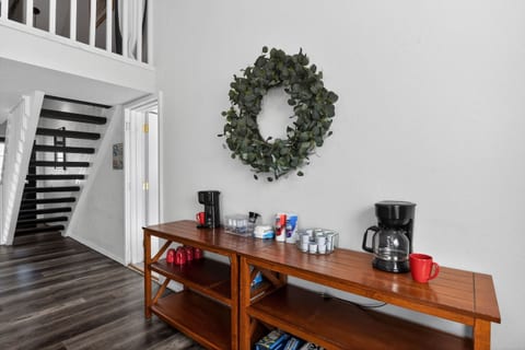 Deluxe coffee station featuring two coffee machines, a variety of creamer, sugar, and filters, and all essentials for your morning brew. Perfect for coffee lovers looking to start the day relaxed and energized