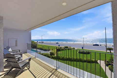 Covered balcony with ocean views—steps to the sand and surf.