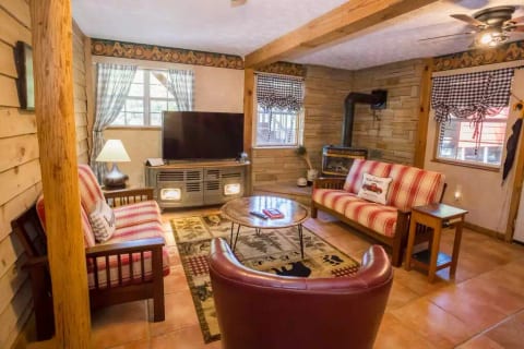 Downstairs den with propane stove for those cool nights.