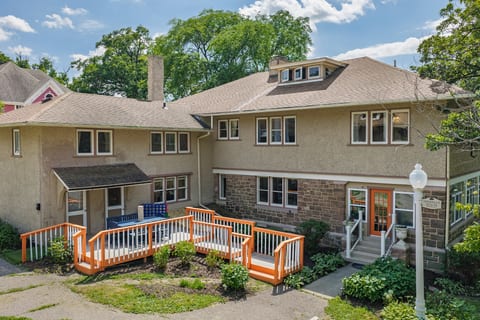 Welcoming exterior with charming stonework and accessible front ramp