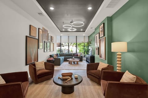 Stylish modern lounge with designer lighting, art, and inviting seating