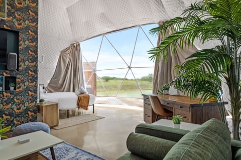 Bright designer dome with panoramic views, cozy lounge, and workspace