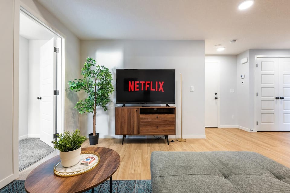 Bright modern lounge with streaming TV and warm, inviting design