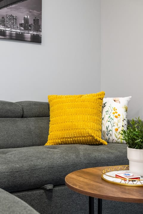 Cozy modern lounge with stylish decor and bright accent pillows