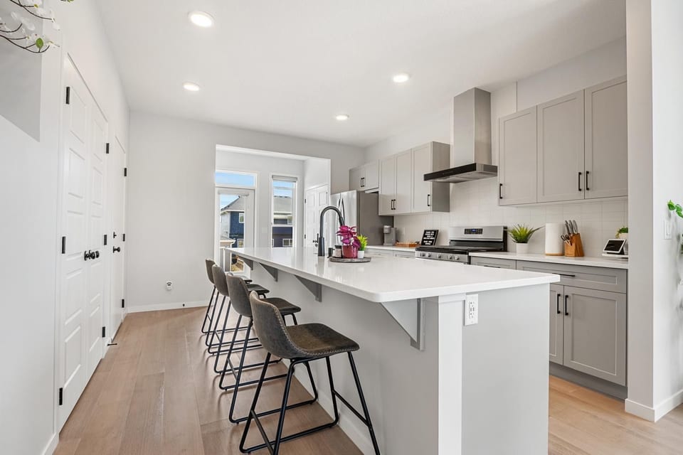 Bright modern kitchen with large island seating for four