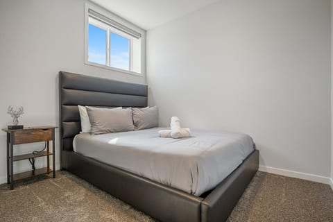 Bright, minimalist bedroom with cozy bed and natural light