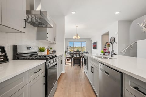 Bright modern kitchen with island seating and open dining area views
