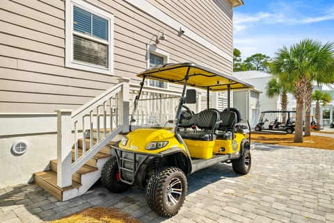6-passenger golf cart included—cruise the palm-lined community