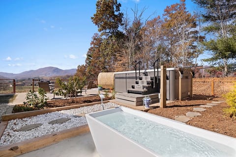 12+ person heated swim spa. Indulge in the serene views year round! Soaking in the hot tub or doing laps with the infinity current. Cold plunge closed seasonally from
Nov - April**