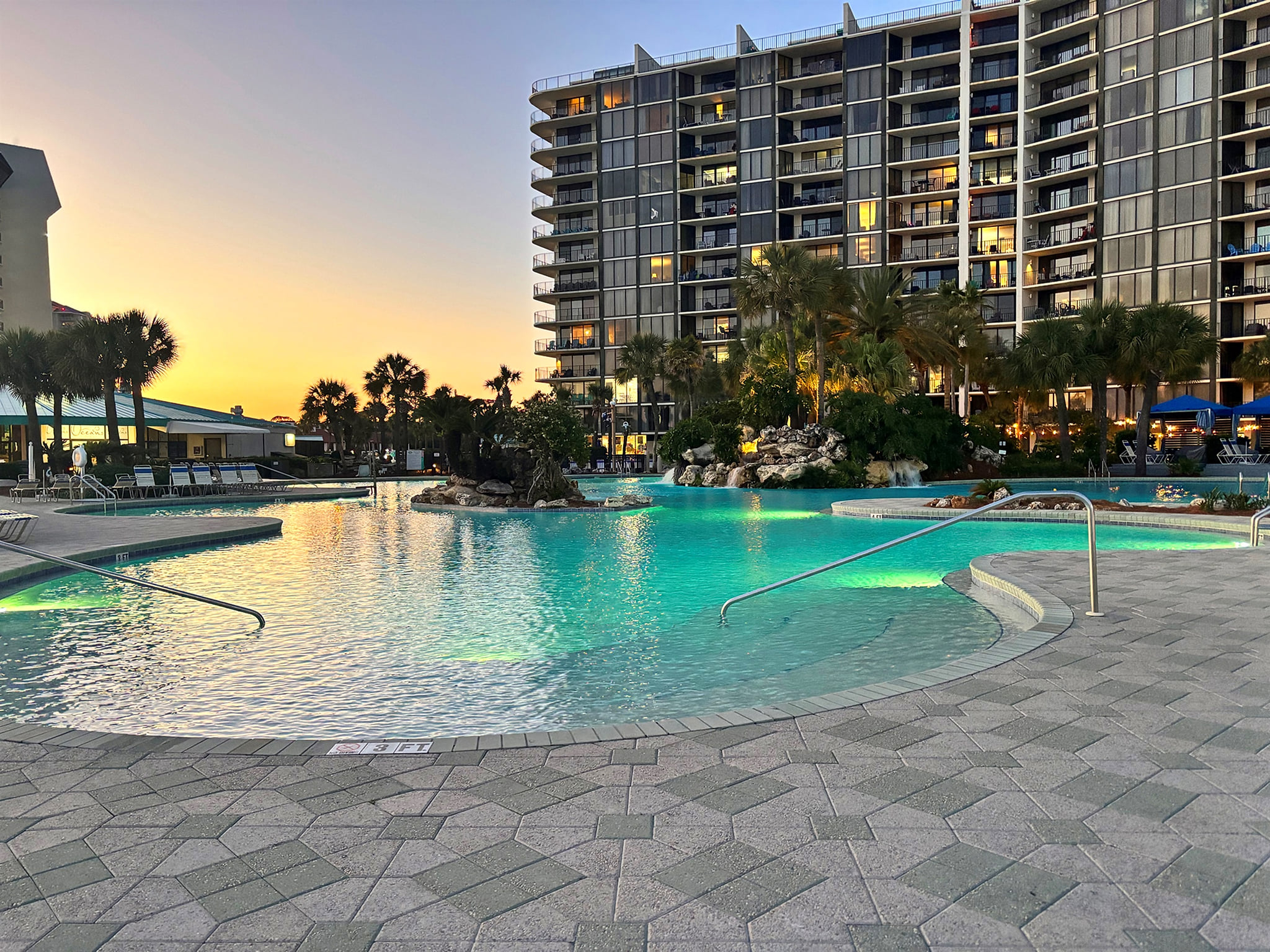 Edgewater Resort's famous beachfront lagoon style pool at sunset