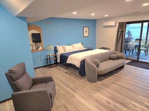 King size bed, night stands with usb charger in clock, recliner chair and couch.

This room also has a fabulous view of the waterfront and glass patio doors to easily access the patio and yard.

The mini split is a heater and air conditioner.