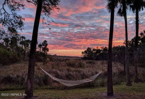 Beautiful Sunsets and Sunrises while you listen to Ocean Waves across the preserve! Picture is to show the sunset / hammock is not there now