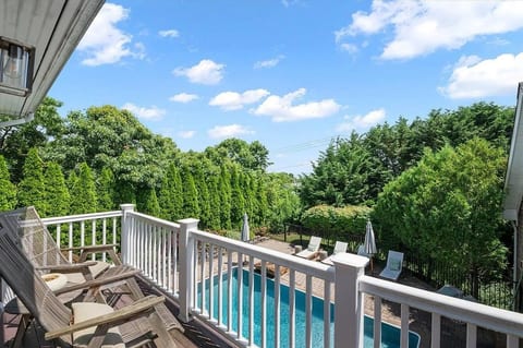 Step outside to your private balcony and wake up to pool views and open sky, a rare feature in a Hamptons rental at this level.