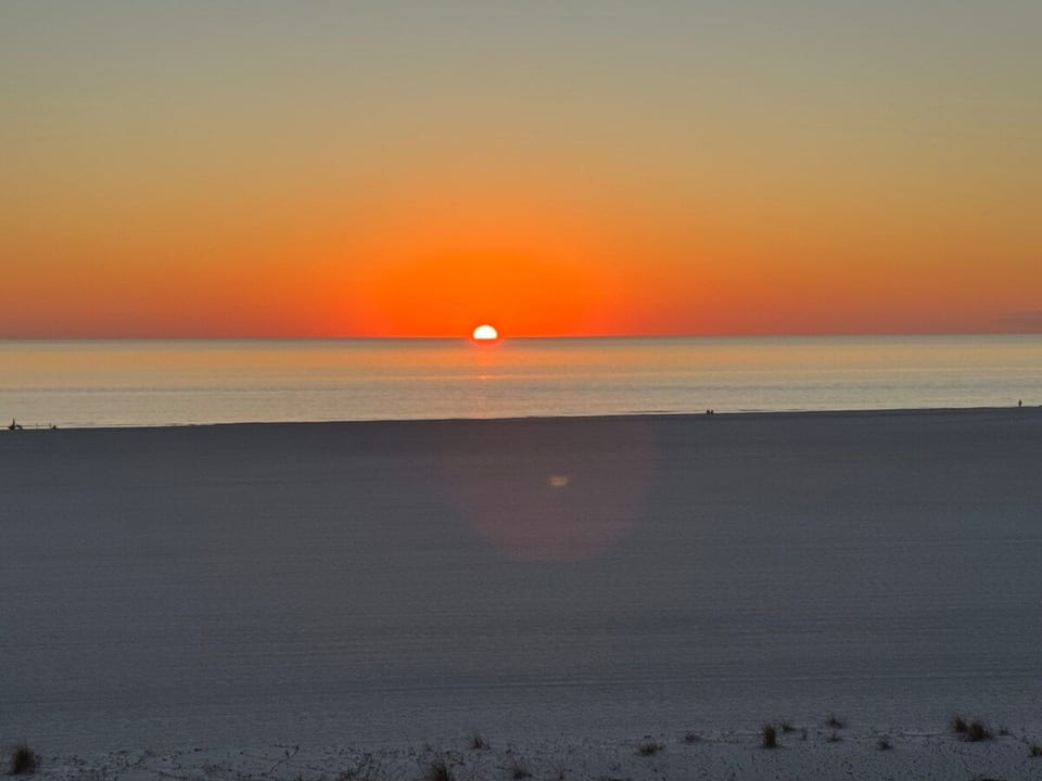 Unobstructed sunset views from our 36 foot long balcony accessible from all rooms. 