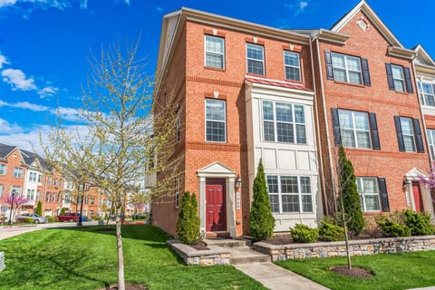 Bright end-unit brick townhome with curb appeal and landscaped entry