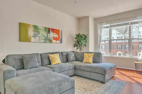 A bright and Cozy living room featuring a large sectional sofa for you to unwind after a long busy day.
