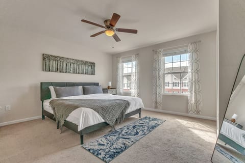 Bright, spacious bedroom with natural light and a modern cozy feel