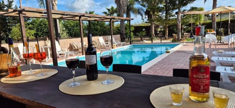 This luxurious villa features a stylish, sunken swim-up bar, making it the perfect social hub for afternoon cocktails and evening parties, offering both, a dry, covered lounge area and in-pool seating!!