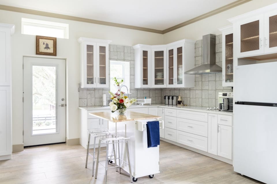Bright modern kitchen with island seating and abundant natural light