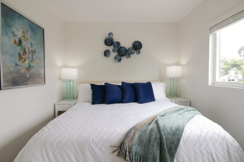 Primary bedroom with king bed and garden window