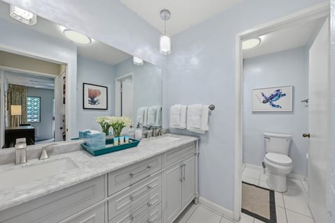 Spa-fresh bathroom with marble counters, fresh flowers, and amenities already stocked for you.