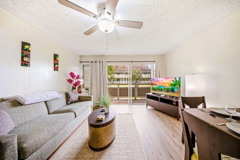 Stretch out on the sofa with the lanai breeze drifting in and the garden framed like a postcard.