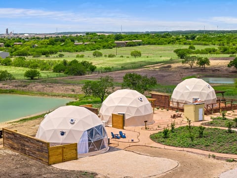 Scenic glamping domes with pond views and peaceful countryside setting