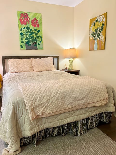 Queen bed with comfy linens. Peep the vintage bed skirt!