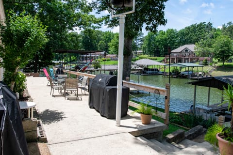 Patio with smoker, charcoal grill, gas grill combo. Also separate gas grill, chiminea(with plenty of wood) and gravity recliners.