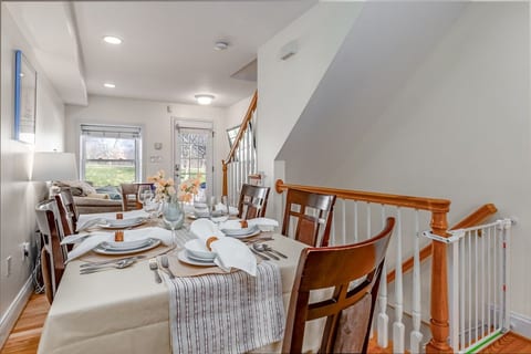 The dining table easily accommodates 6 guests, with wooden stools for up to 4 additional guests willing to squeeze.
