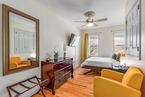 Master bedroom overlooking park with California king bed.