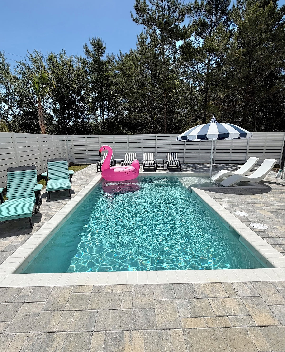 Our new 10â x 22â pool with tanning /splash shelf and new pool furniture!