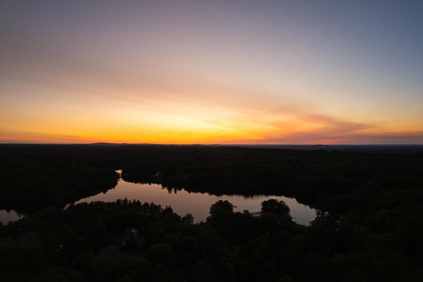 Aerial lake view highlighting the surrounding natural landscape