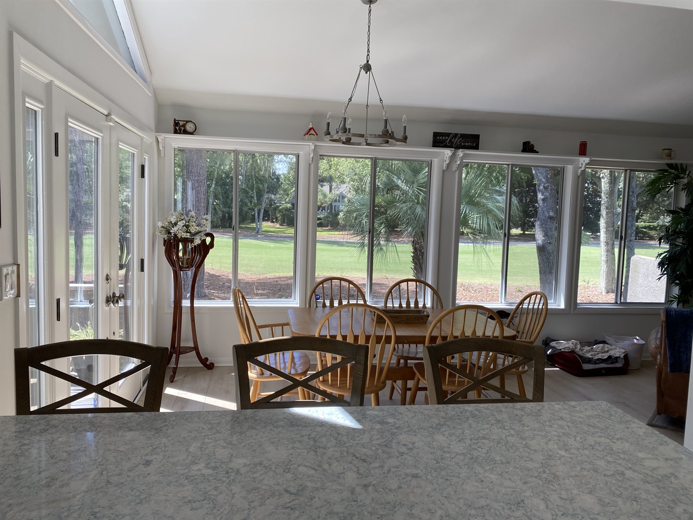 View from kitchen to dining room and 2nd fairway
