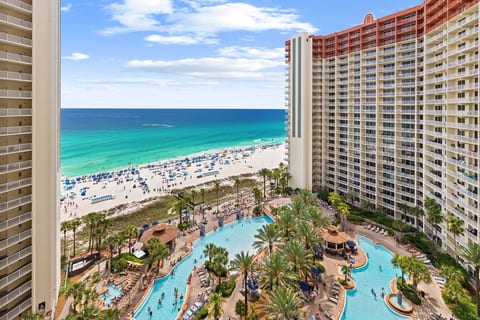 Take in sweeping views of the turquoise Gulf, white-sand beach, and sprawling tropical resort pool from this elevated vantage point.