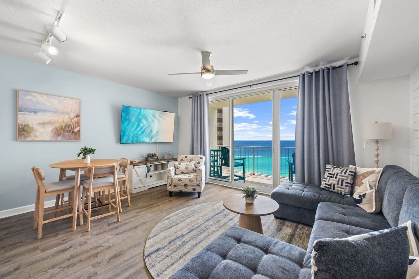 Relax in the bright open-concept living area with comfortable seating and breathtaking Gulf-front views.