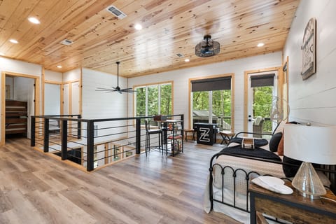 Upstairs loft with daybed, King bedroom and bunk room.  Access to top deck. 