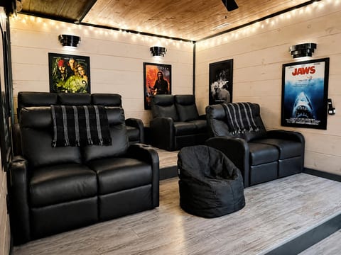 Private home theater with plush recliners and cinematic movie-night vibes