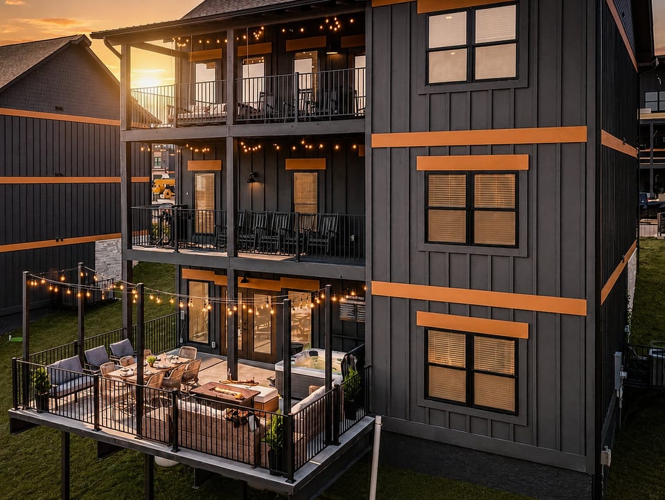Sunset patio with string lights, hot tub, and spacious covered balconies