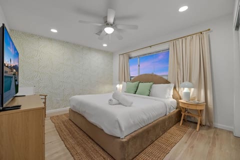 Serene bedroom w/ plush bed and soft lighting, designed for restful nights and slow mornings.