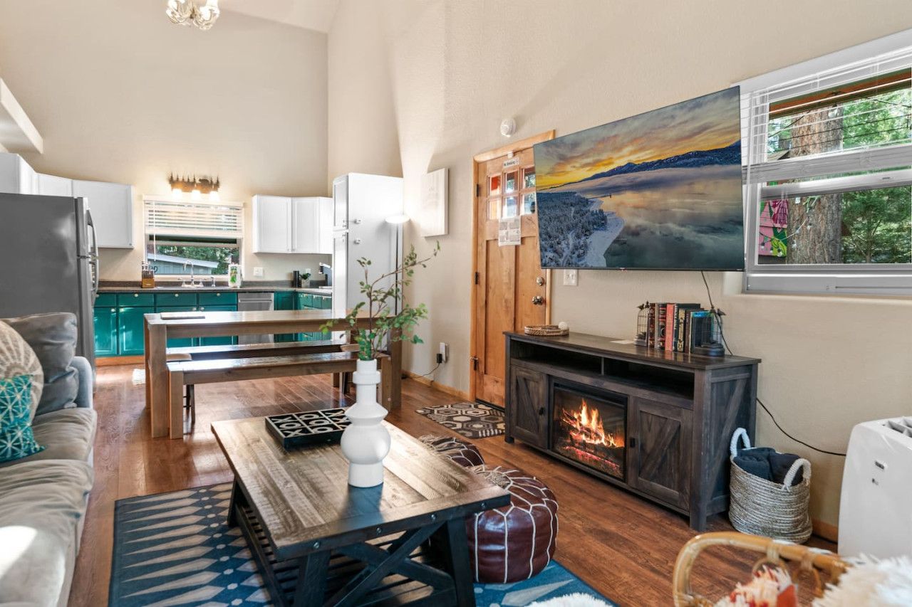 Inviting living room w/ fireplace, comfy couches, & rustic touches for laid-back evenings.