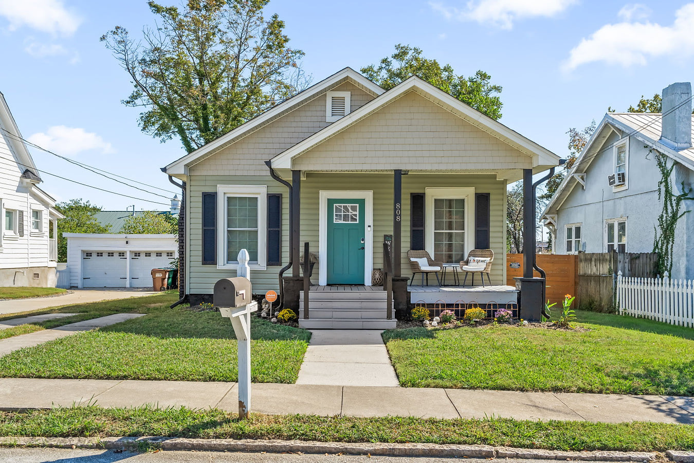 Charming front exterior w/ classic curb appeal, inviting porch, & a warm welcome from the moment you arrive.